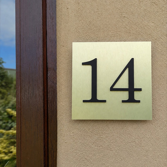 Gold House Number Plaque - matt acrylic numbers mounted onto brushed gold