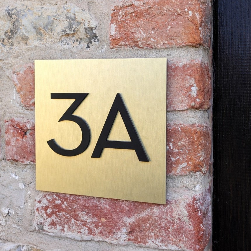Gold House Number Plaque - matt acrylic numbers mounted onto brushed gold